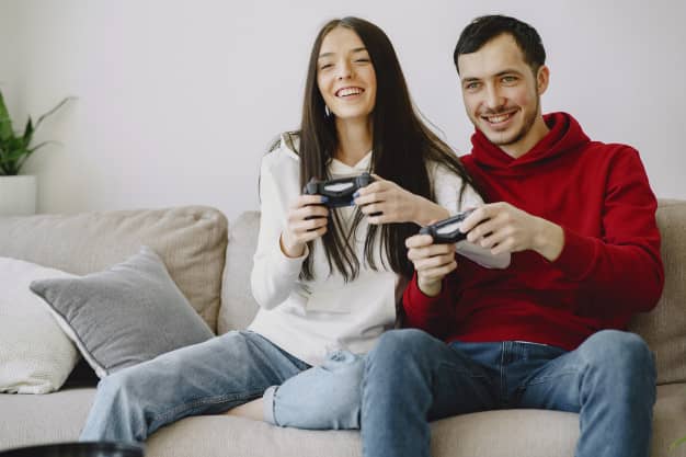 couple enjoying a home date playing video games