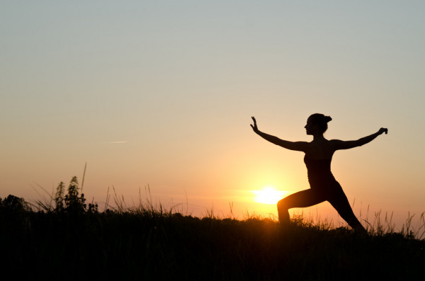 Young Woman Doing Tai Chi - a meditative exercise form