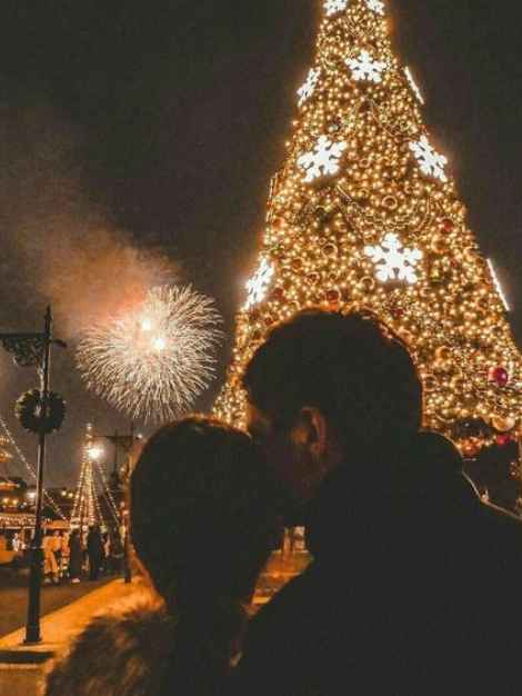 couple enjoying Christmas lights