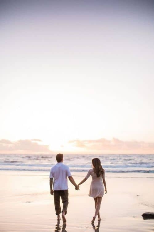 Couple walking together on a beach