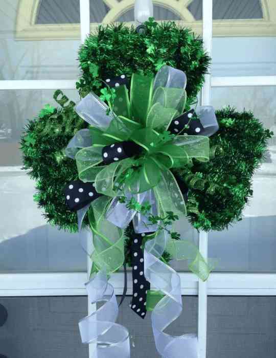 Green bottlebrush shamrock wreath with ribbon for St Patrick’s Day
