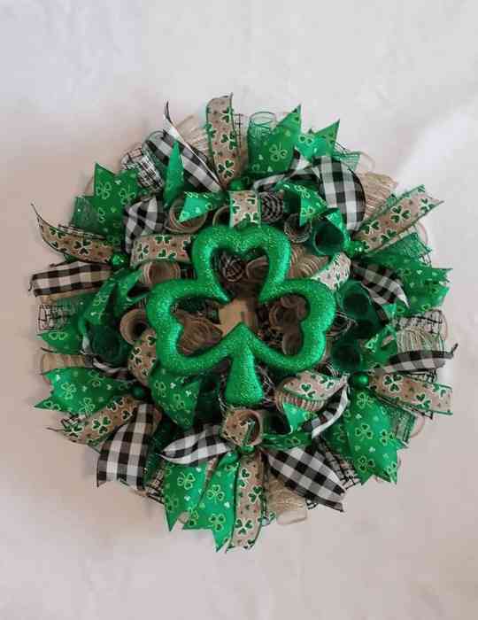 Traditional St Patrick’s Day wreath with shamrock and ribbon